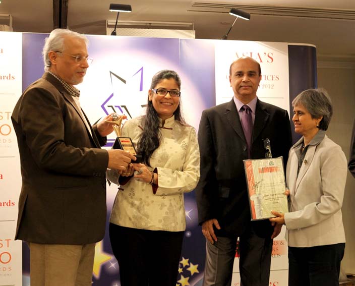 Charu Receving Award.jpg