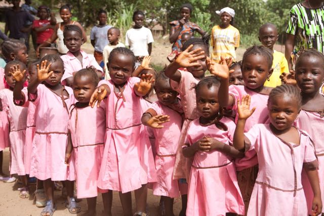 shine-on-sierra-leone-students-smiling-hands (1).jpg